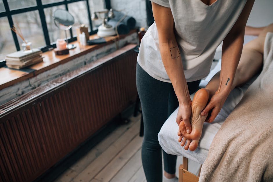 Professional foot massage in a serene and cozy indoor setting.